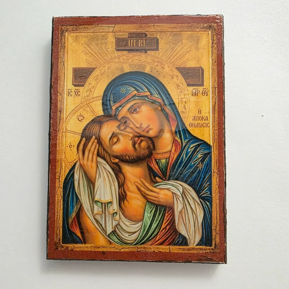 Holy Apokathelosis: Theotokos Embraces the Crucified Christ Holy Apokathelosis Orthodox wooden mounted icon showing the Theotokos embracing the Crucified Christ.